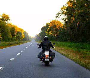 Rider travelling between offices on a highway