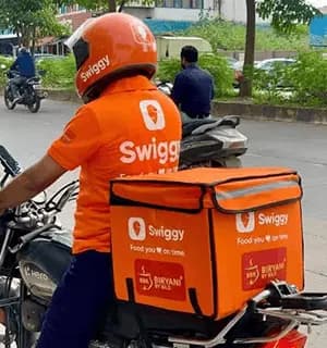 Delivery partner riding a rented bike